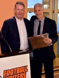 Main photo: University of Southern California SID Tim Tessalone (right) receives the FWAA Bert McGrane Award from outgoing FWAA President Chris Dufresne at the FWAA Awards Breakfast on Jan. 6 in Newport Beach, California.